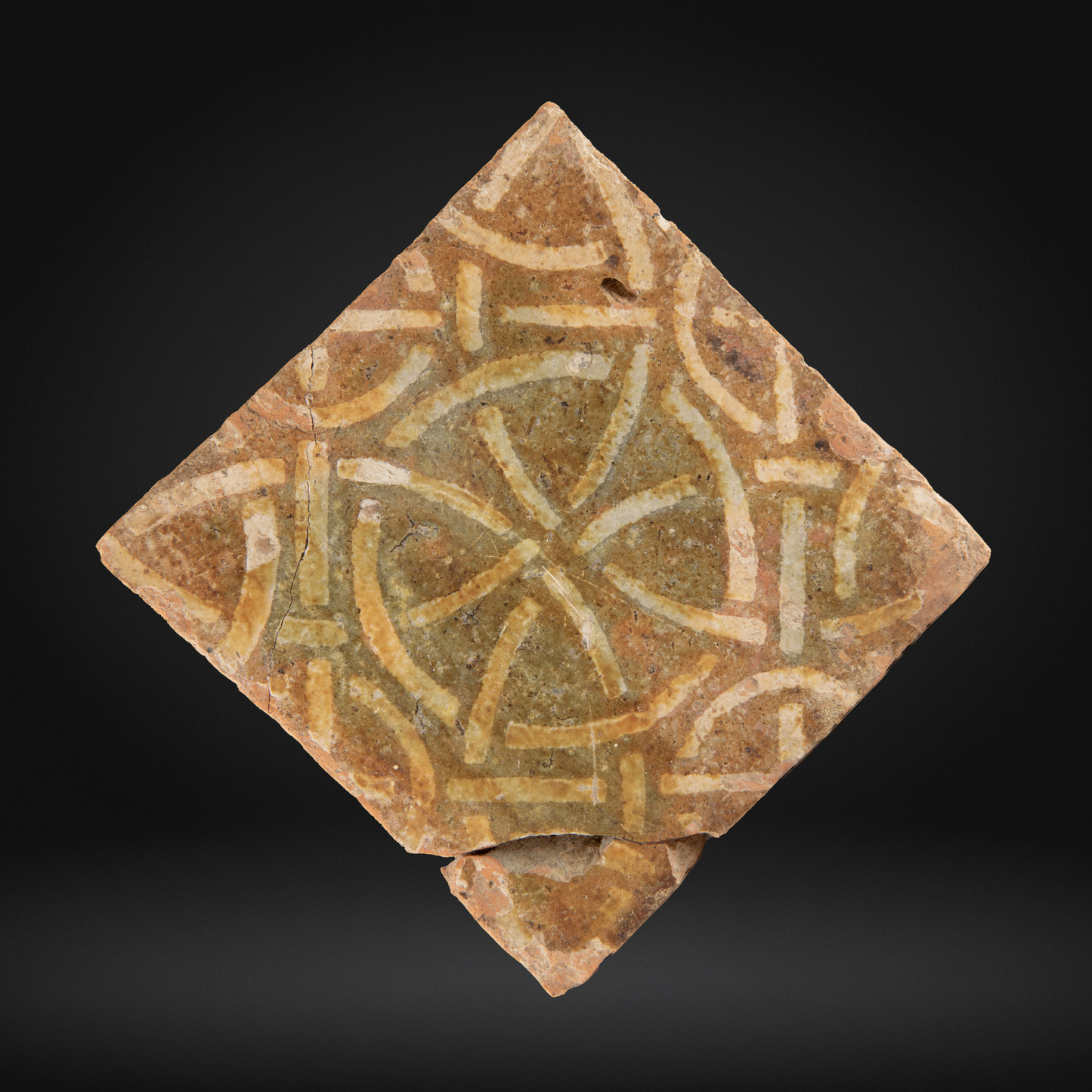 Medieval Encaustic Floor Tile, Intricate Geometric Pattern - 14th Century, Northern France, featuring a worn antique ceramic tile with interlaced circle and line motifs in earthy tones.