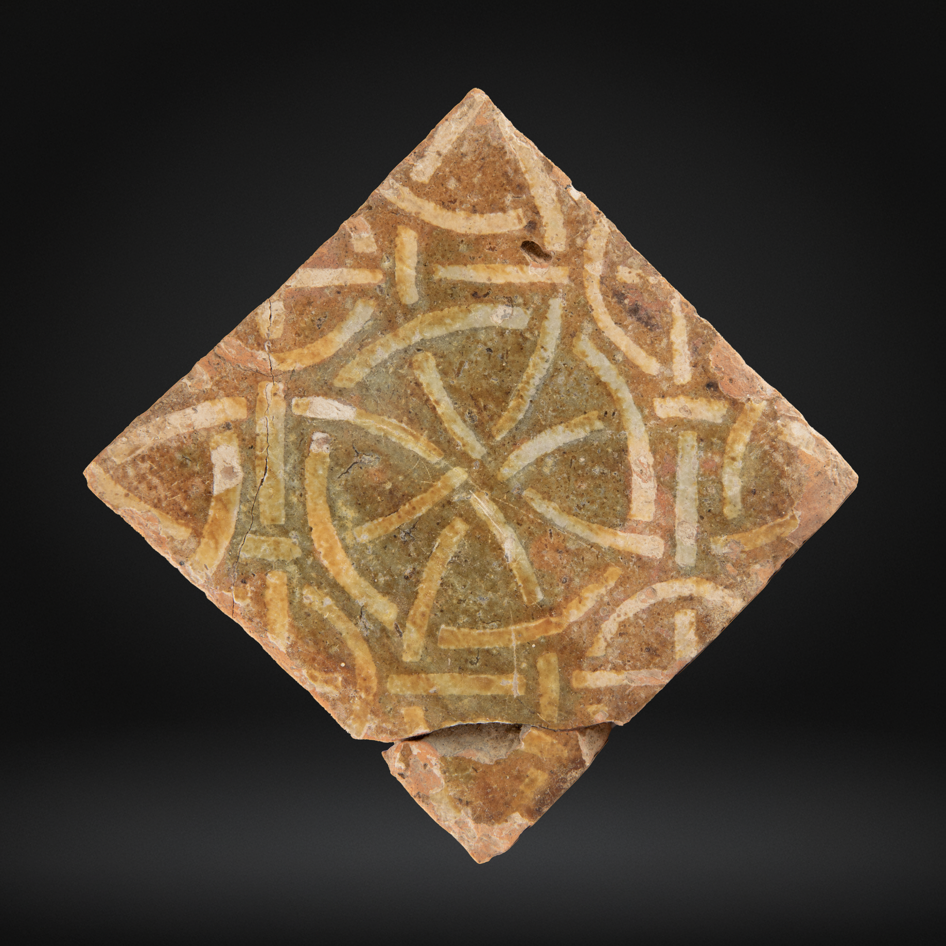 Medieval Encaustic Floor Tile, Intricate Geometric Pattern - 14th Century, Northern France, featuring a worn antique ceramic tile with interlaced circle and line motifs in earthy tones.