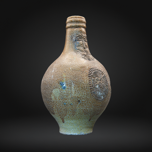 Front view of a uk found bellarmine jug, salt glazed witch bottle.