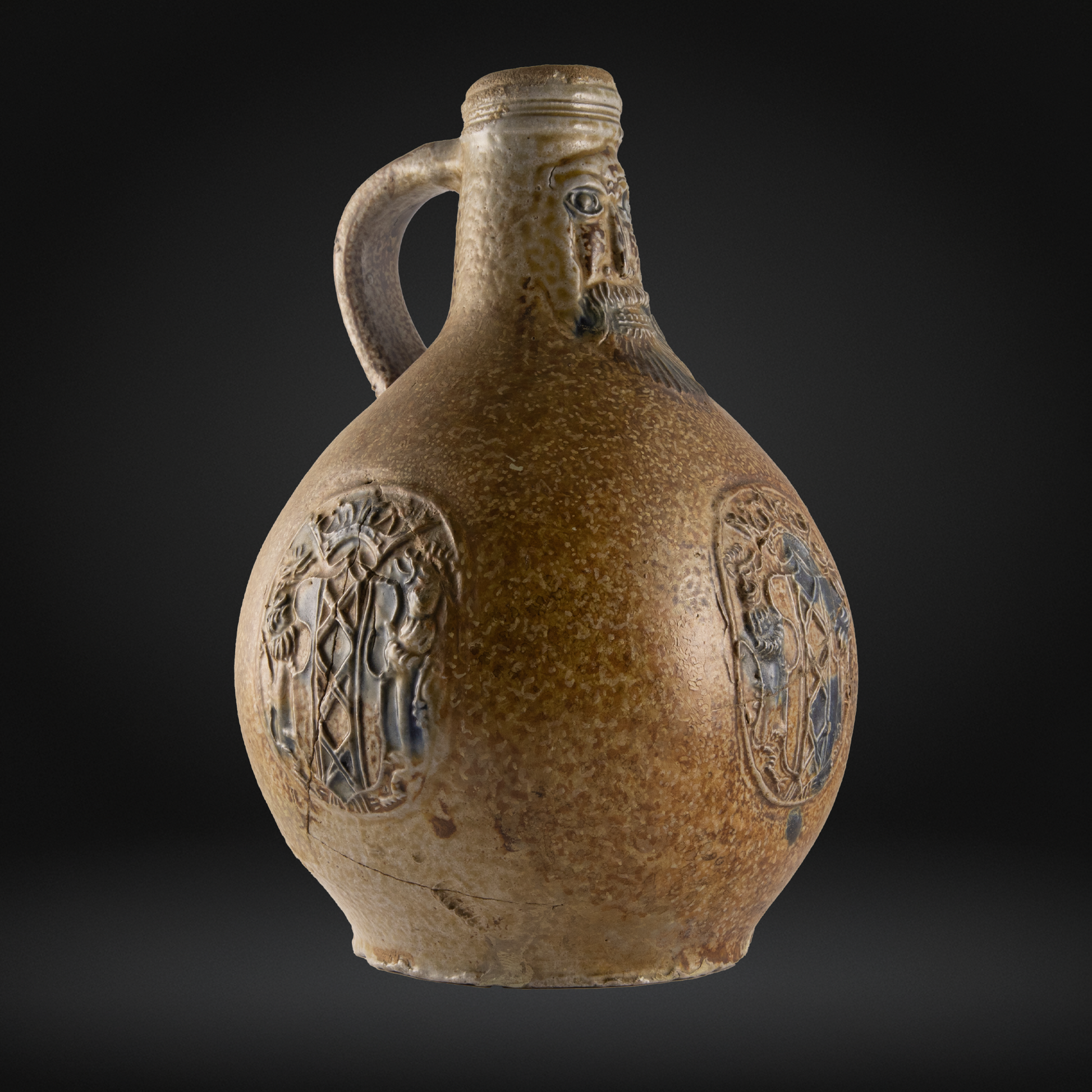 Brown ceramic jug with decorative embossments on a black background
