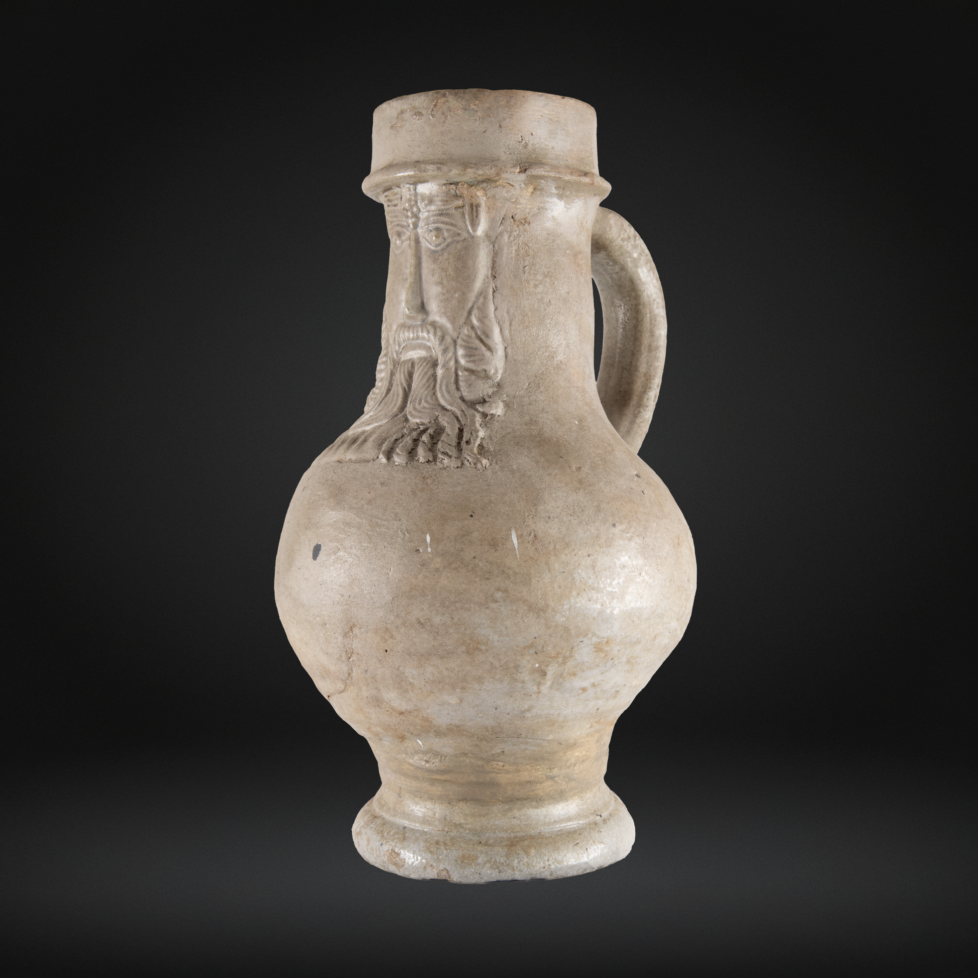 16th Century Raeren Salt Glaze Stoneware Bellarmine Jug featuring a detailed bearded face mask on the neck, crafted from German salt glaze stoneware.