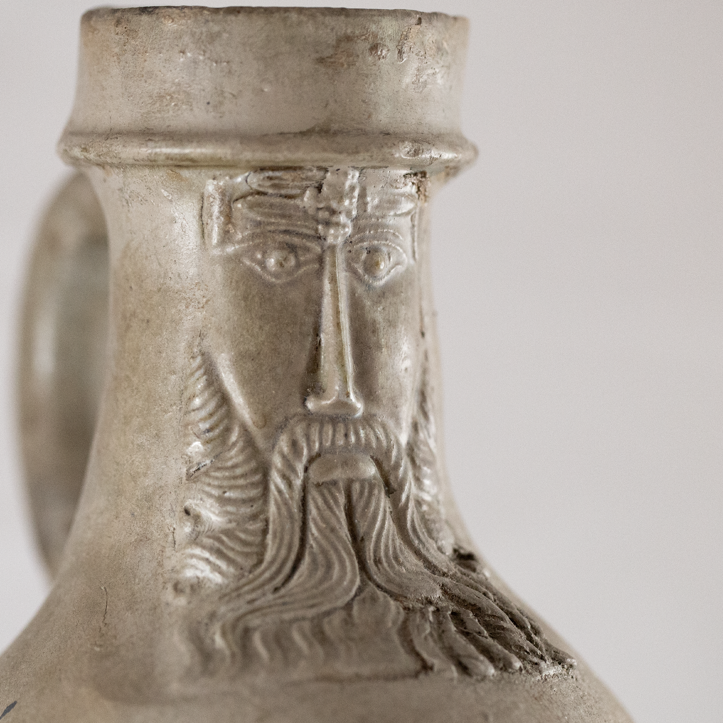 16th Century Raeren Salt Glaze Stoneware Bellarmine Jug featuring detailed relief of a bearded face with a crown, showcasing German stoneware craftsmanship and antique ceramics.