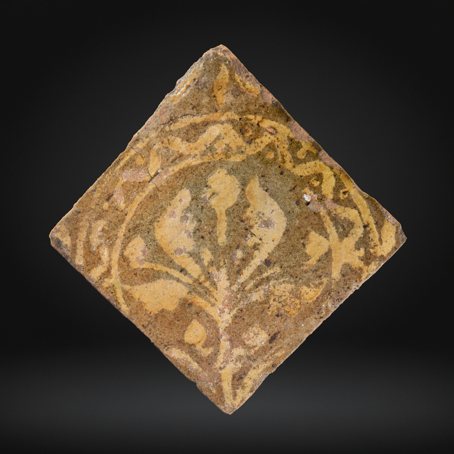 PAIR Medieval Encaustic Quatrefoil Floor Tiles - c14th Century, France, depicting a stylized floral motif in earthy tones typical of medieval encaustic tile craftsmanship.
