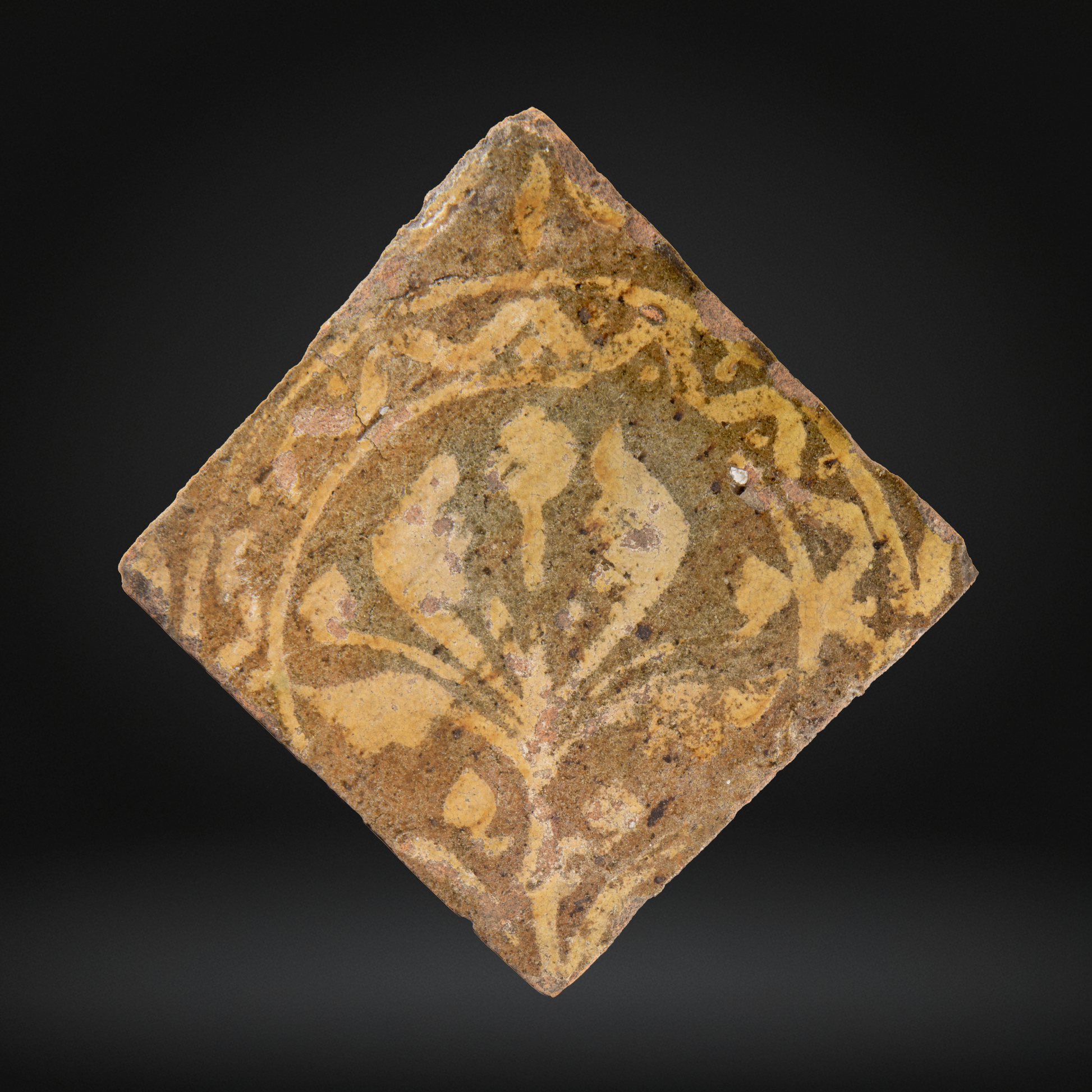 PAIR Medieval Encaustic Quatrefoil Floor Tiles - c14th Century, France, depicting a stylized floral motif in earthy tones typical of medieval encaustic tile craftsmanship.